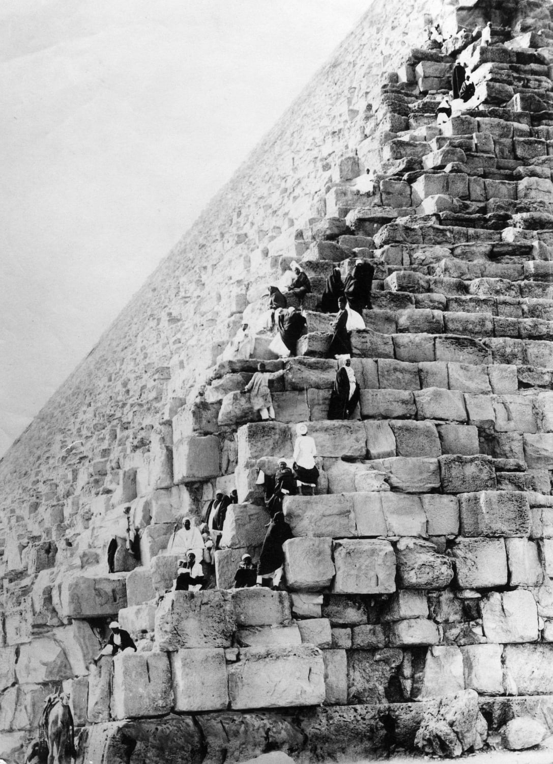 Tourist climbing the Pyramids in Egypt in the early 1900’s