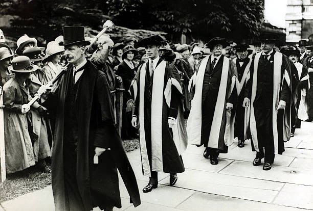 HRH Prince Albert, the Duke of York, at Cambridge University as he receives a degree, followed in the procession by Former President of the United States Howard Taft. The Duke of York is brother to Edward, Prince of Wales, heir to the British throne.