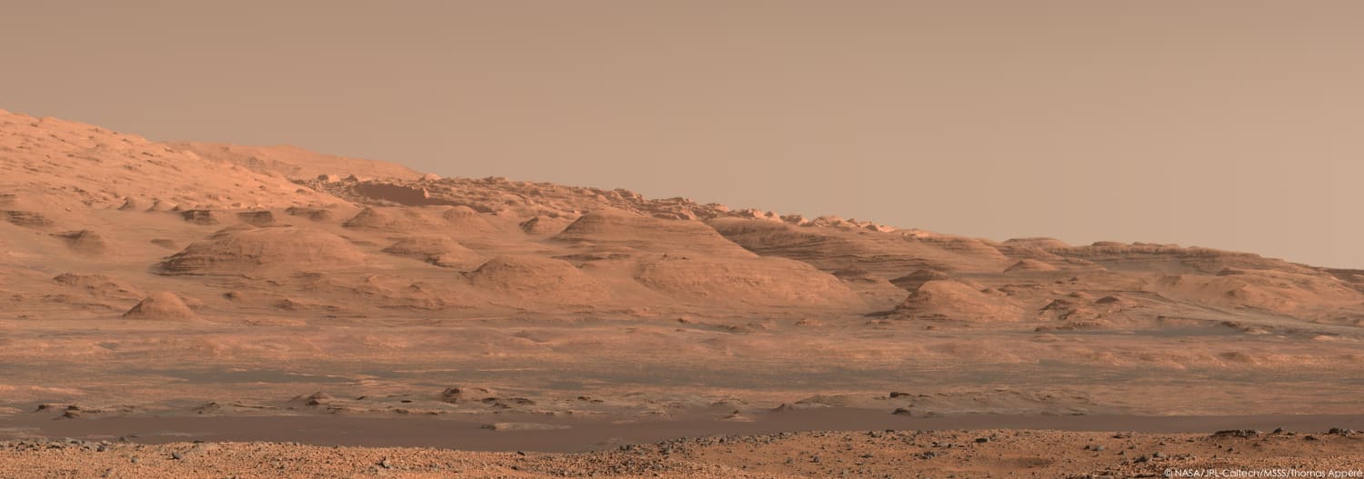 The foothills of Mount Sharp in a beautiful sunlight as Curiosity rover imaged them on 29 November 2013 at 4:00 pm Martian local time. This is a mosaic of 14 color calibrated pictures downloaded on the Planetary Data System. Curiosity rover is currently located on the extreme right of this panorama.
