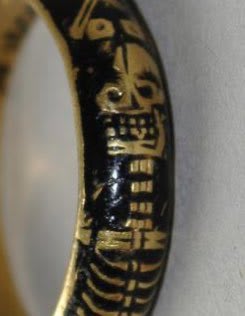 A skeleton wraps around the hoop of this gold mourning ring, enamelled in black. The skeleton is joined by symbols of death - spade & pick, crossed bones and hourglass. Inscribed for Cpt Robert Jackson - died 29 Oct 1726 (@britishmuseum)