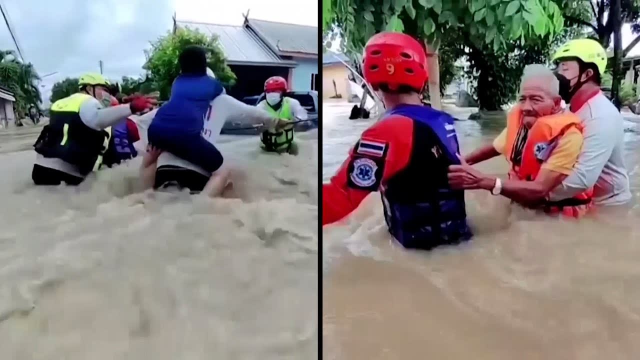 Rescuers Carry Flood Evacuees on Their Backs