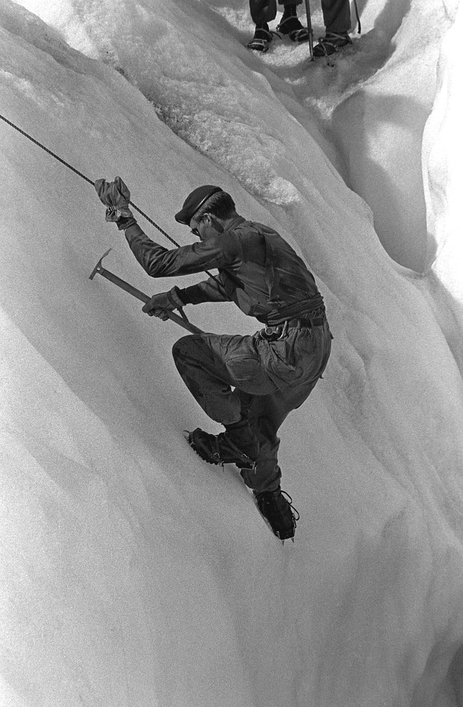 SSGT Michael Peterson, 4th Brigade, 23rd Infantry Battalion, demonstrates the correct technique for ice climbing while traversing the Sheridan Glacier, OTD in 1982
