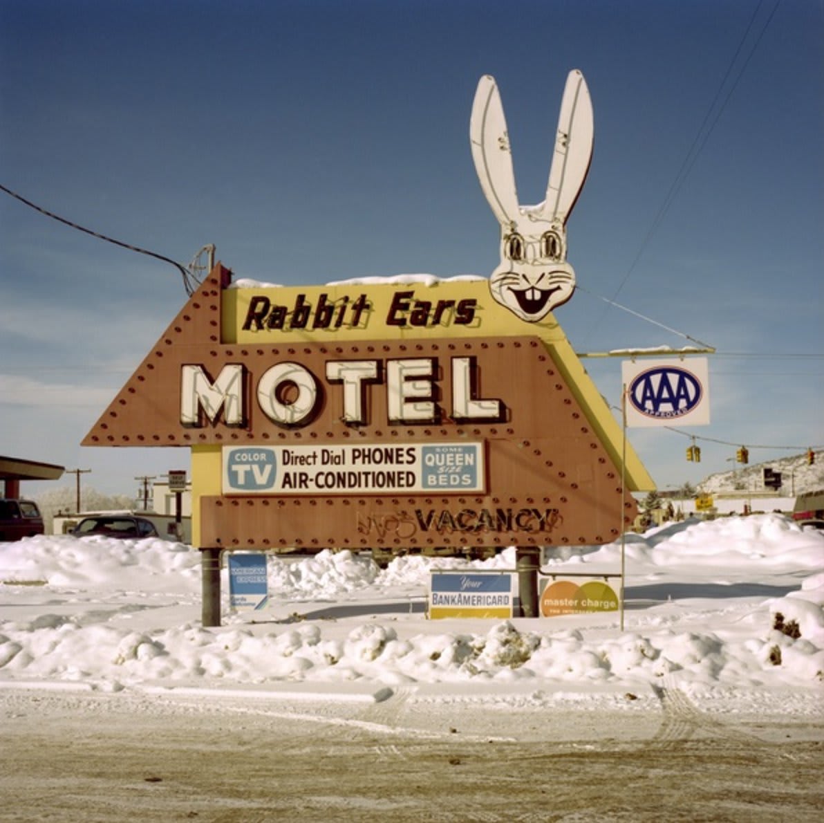 Steve Fitch, "American Motel Signs," on view at @photoeyebooks, documents the nostalgic signs made to invite travelers to stay the night.
