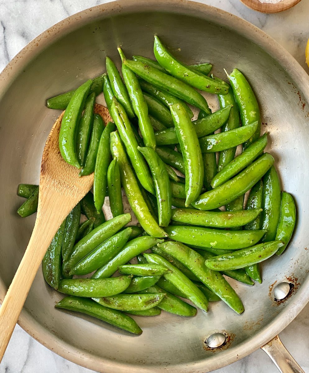 Sautéed in a fiery skillet with a glug of olive oil and finished with a squeeze of lemon, sugar snap peas make for a light and vibrant side with a tender, snappy bite and bright flavor: