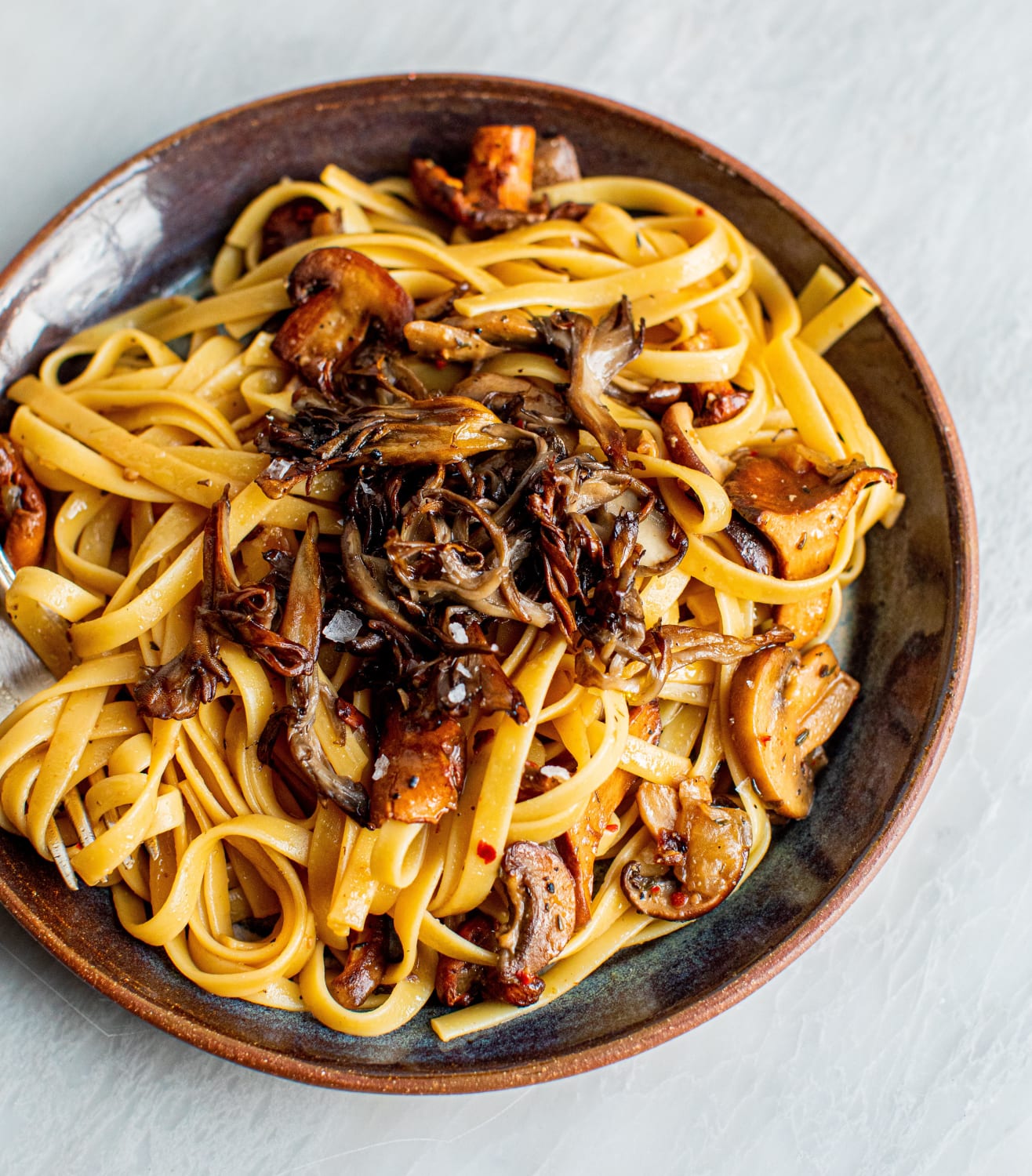 I need to write a cookbook called "Almost Vegan" for all the times I try to make a vegan recipe but accidentally add butter at the last second! This is a very mushroom-y fettuccine – cremini, shiitake, and chanterelles...topped with crispy maitake!