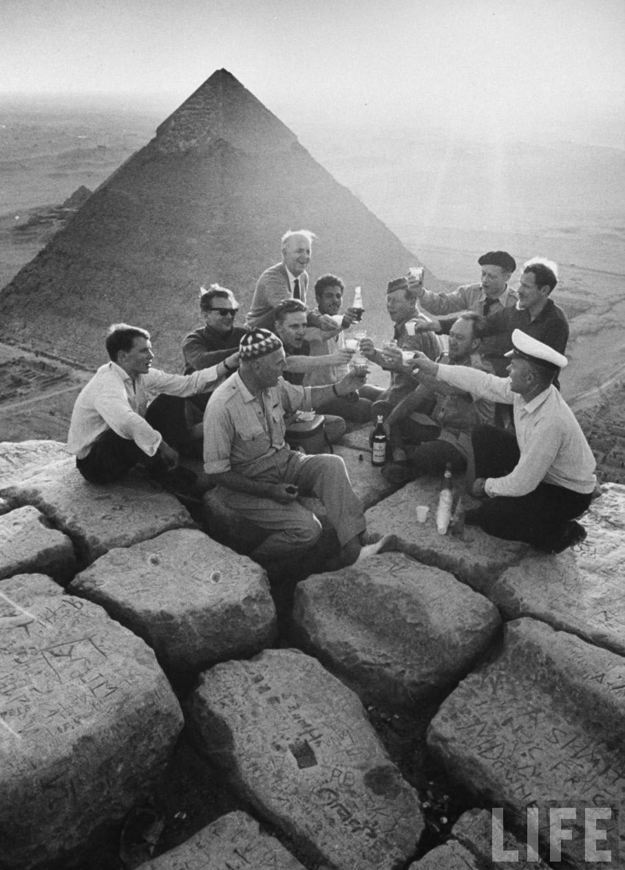 An old photo showing a party at the summit of the 4600-year-old Great Pyramid of Giza, by life magazine, 1940's