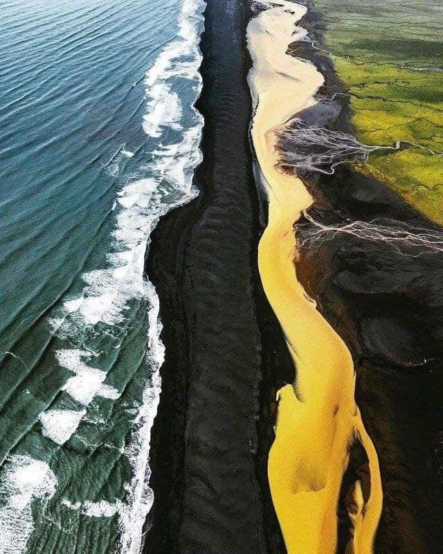 Yellow river, Black beach, and Blue sea in Iceland