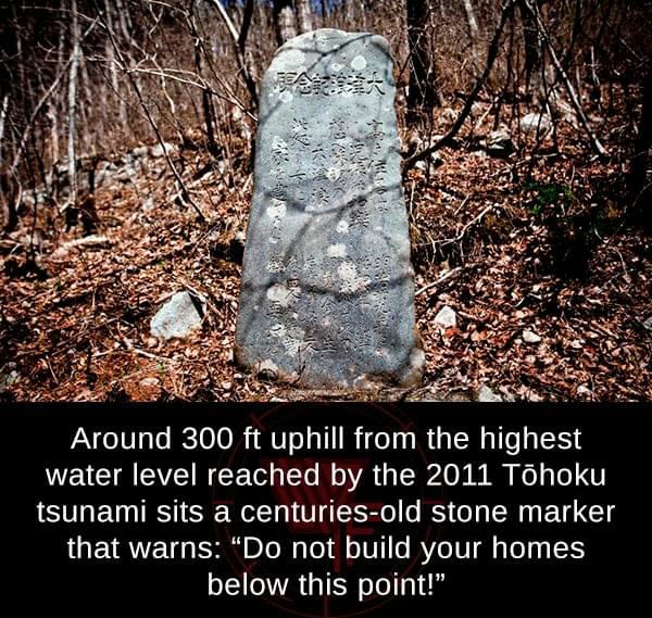 300 ft uphill stone marker with a warning
