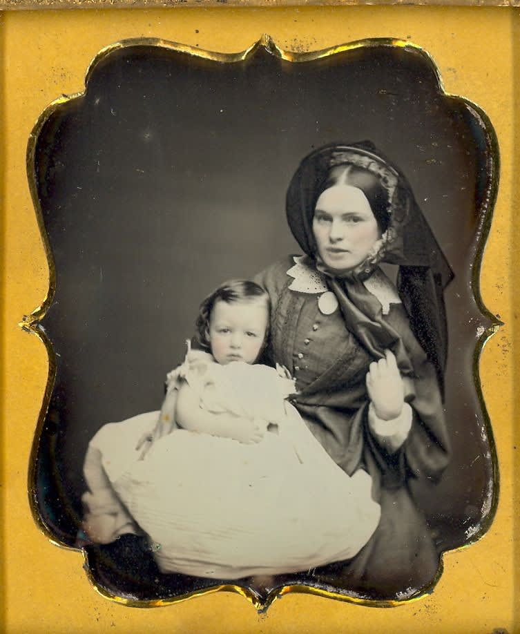 Daguerreotype of a woman holding her son, c. 1850s