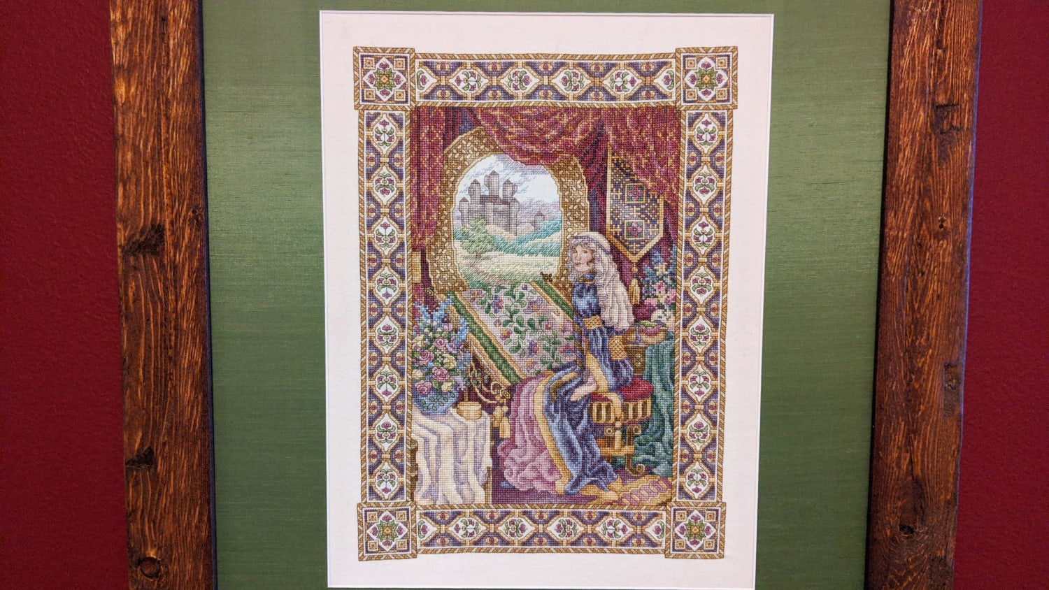 I cross stitched the Lady of Shalott over 22 years. She's embroidering a floral tapestry, trapped in her castle. This is my biggest quarantine finish. Blog post with high res images in comments.