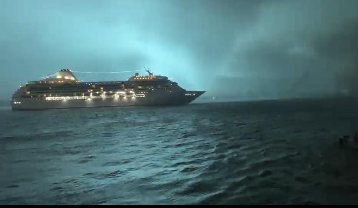New Orleans cruise ship passes in front of tornado on Mississippi River while transformer blows up