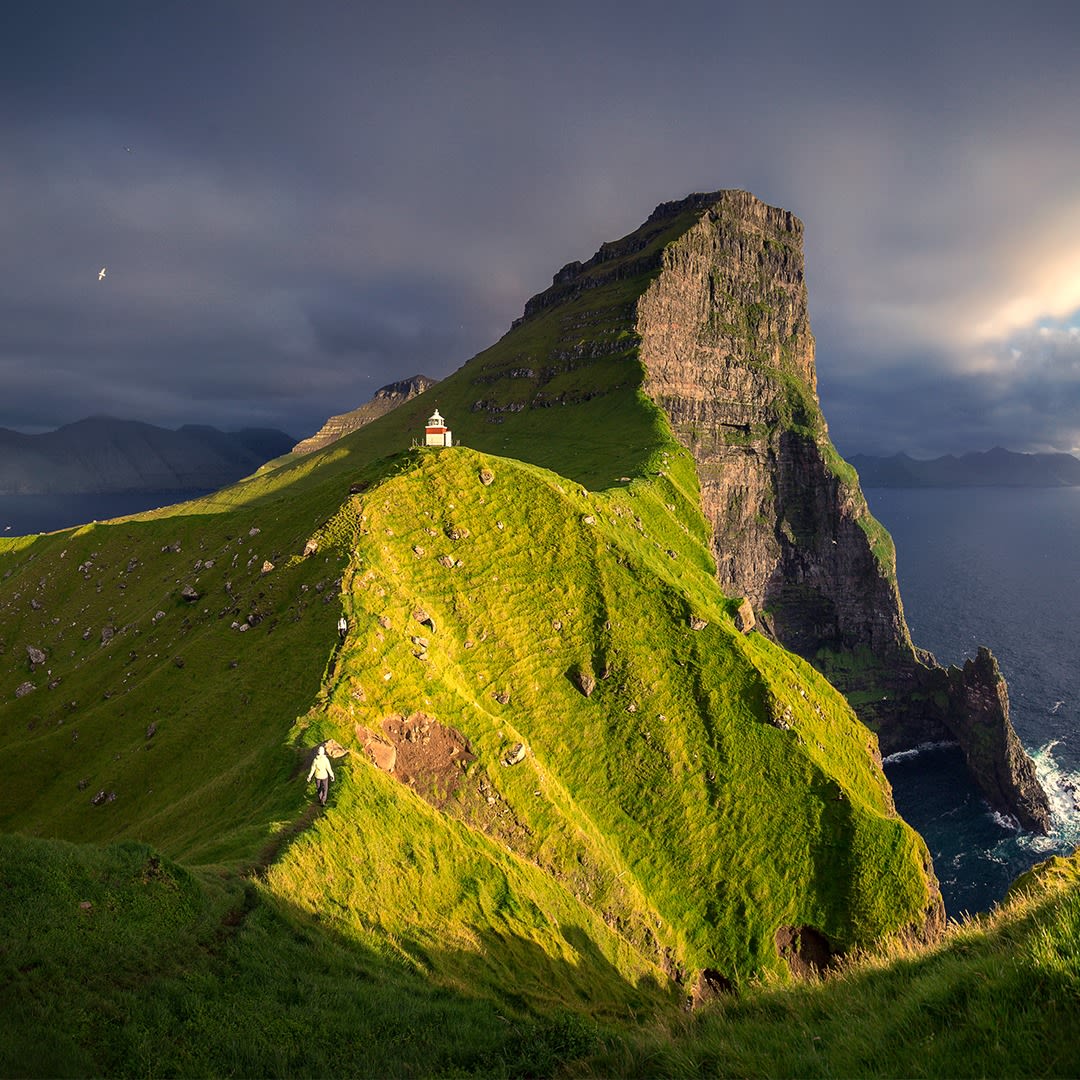The picturesque Kallur lighthouse on Kalsoy Island.insta:marcograssiphotography