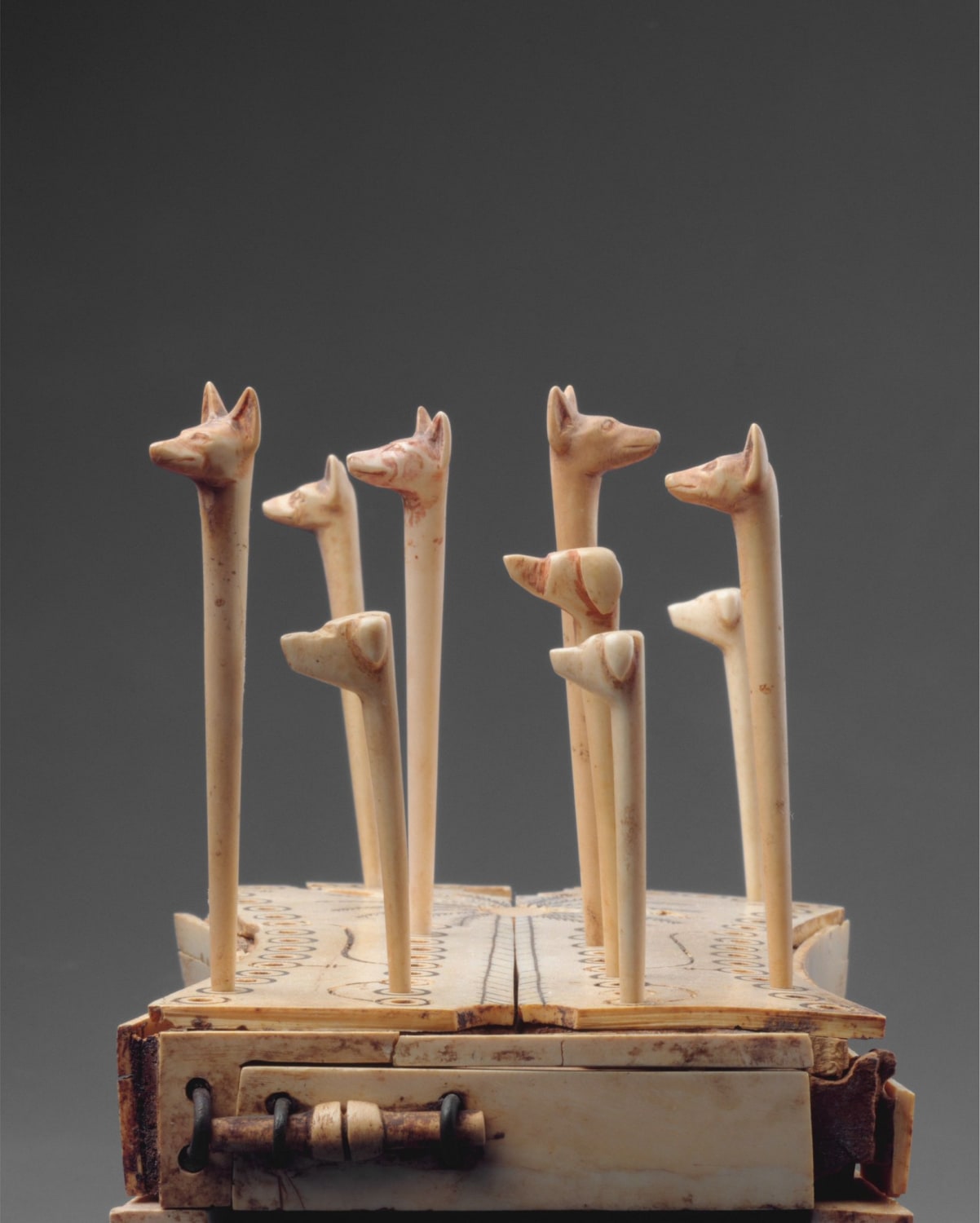 Up for a game of Hounds and Jackals? 🎲 Ancient Egyptians likened the intricate voyage through the underworld to a game. This made gaming boards and gaming pieces (like this one) appropriate objects to place in tombs. Learn more on the