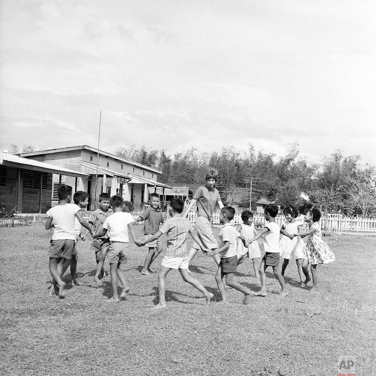OTD in 1961, President John F. Kennedy signed an executive order establishing the Peace Corps. Peace Corps volunteer Ann Snuggs of Geneva, Ala., leads a game with Filipino children during recess at a school in San Enrique, Negros Island, Philippines, March 14, 1962.