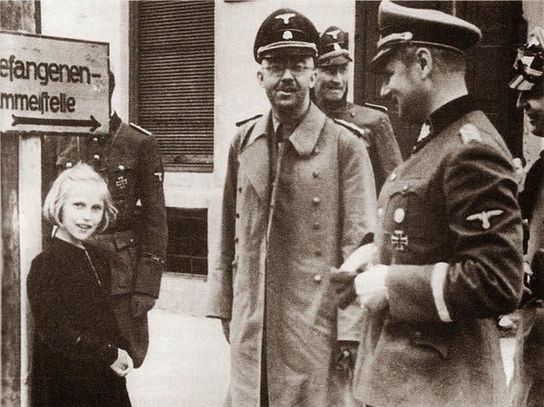 Nazi SS leader Heinrich Himmler on a visit to the Dachau concentration camp with his 12 year old daughter Gudrun, Nazi Germany, 1941.