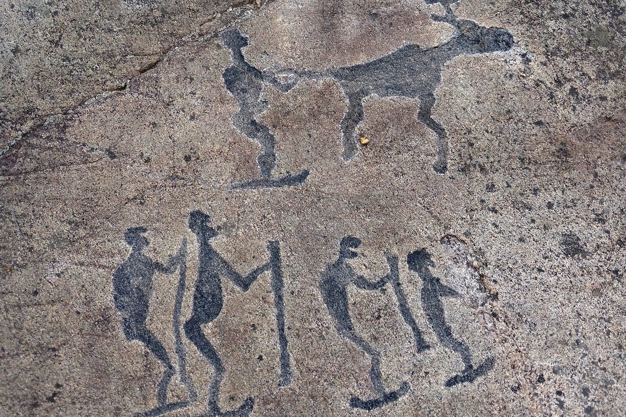 Petroglyph depicting 5 skiers and a reindeer located near the White Sea in Belomorsk Russia. The petroglyphs were created by ancestors of modern Finnic peoples around 4000-3000 BC. With over 2,000 petroglyphs it's one of the most outstanding monuments of primitive art in N. Europe.