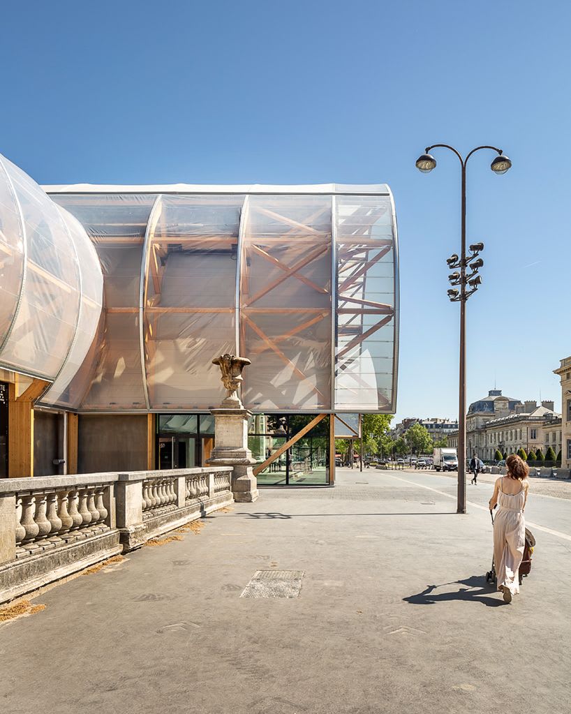 the temporary 'ephémère' grand palais in paris echoes the 19th century ideas of grandeur expressed with the original historic grand palais.