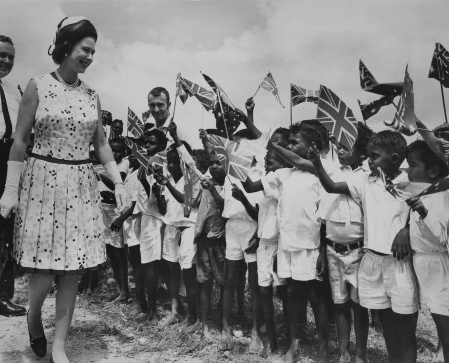 Queen Elizabeth II is greeted by local children at Cooktown in Queensland, during her Royal tour of Australia. April 22, 1970.