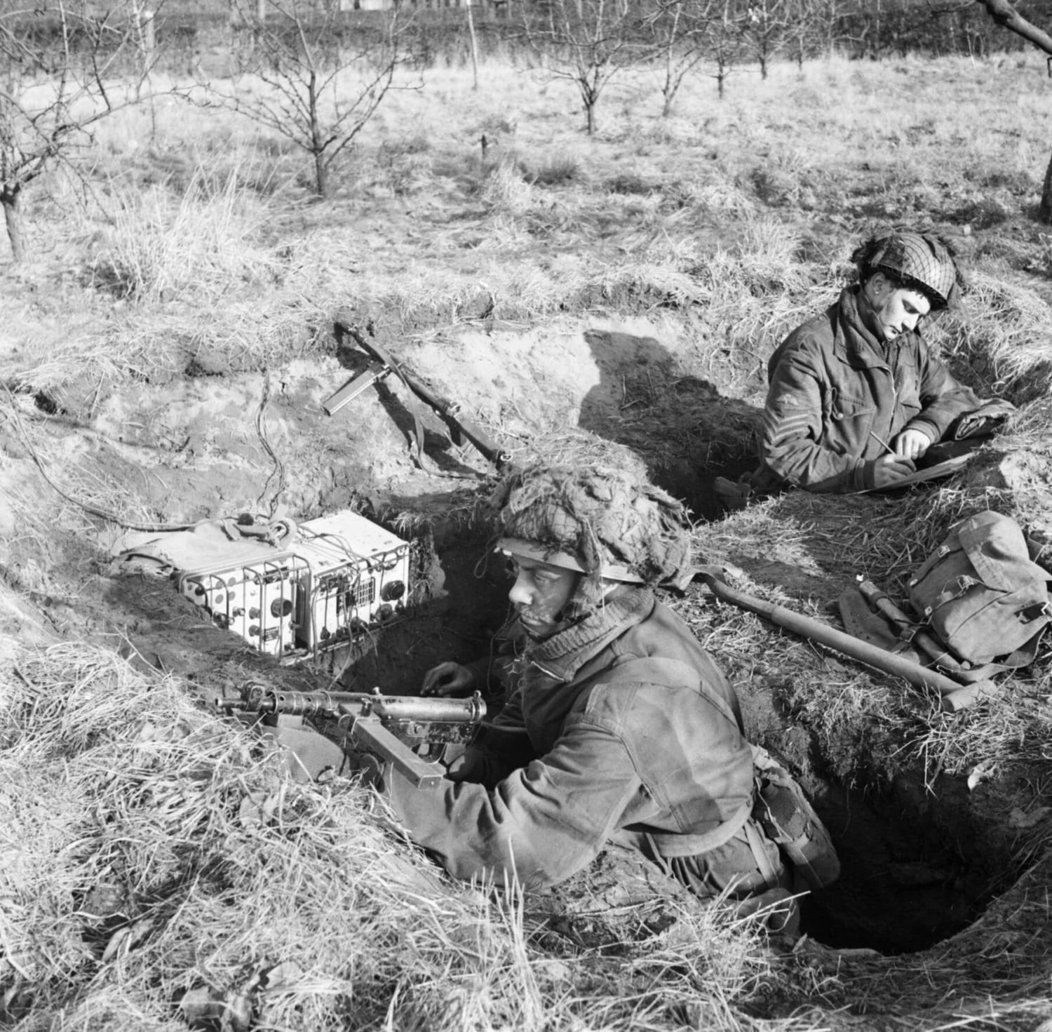 "Airborne troops man a trench with a No. 76 wireless set, Heldon in Holland, 3 February 1945."