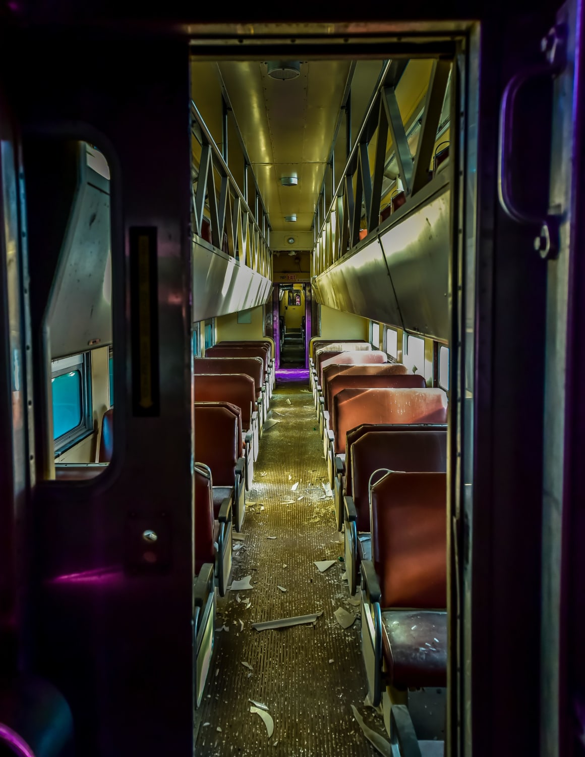 Inside an abandoned train car. The purple lighting was due to spray paint and paper over the windows.