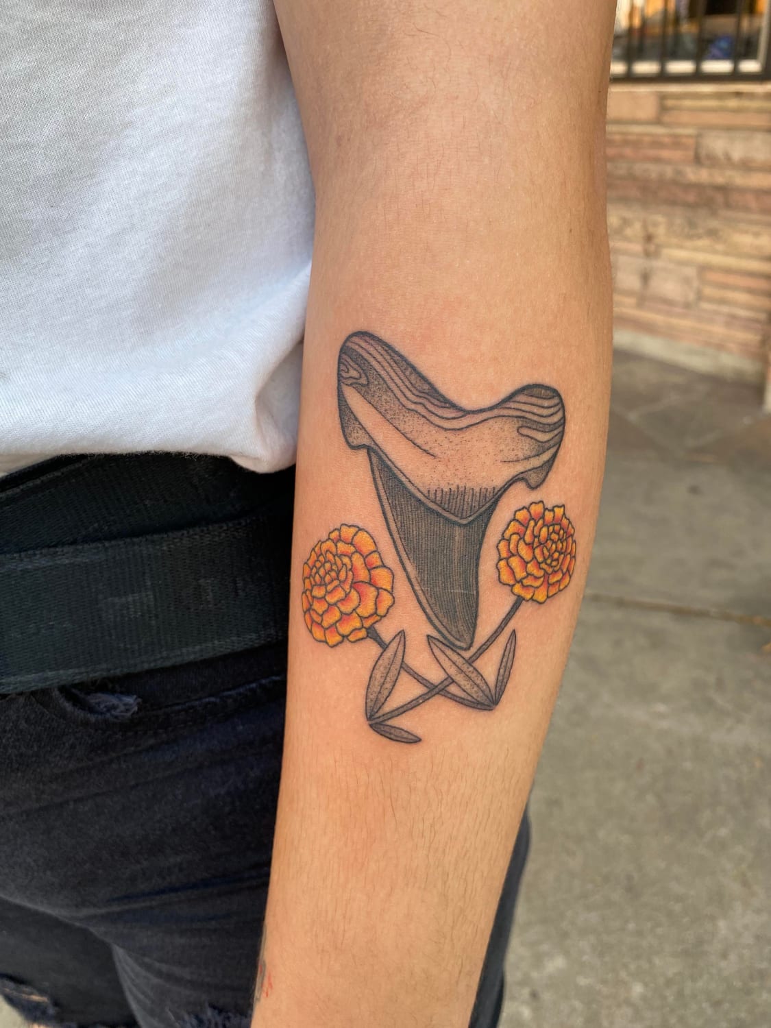 Shark Tooth with Marigolds done by Madeline at Grape Ape Tattoos. Tucson, AZ, USA.
