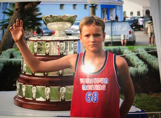 Because 69 is too mainstream. Here's young Medvedev wearing a 68 shirt next to a big trophy