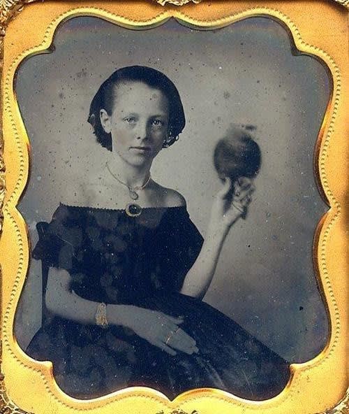Ambrotype of a young woman holding a parrot, c. 1850s ✨