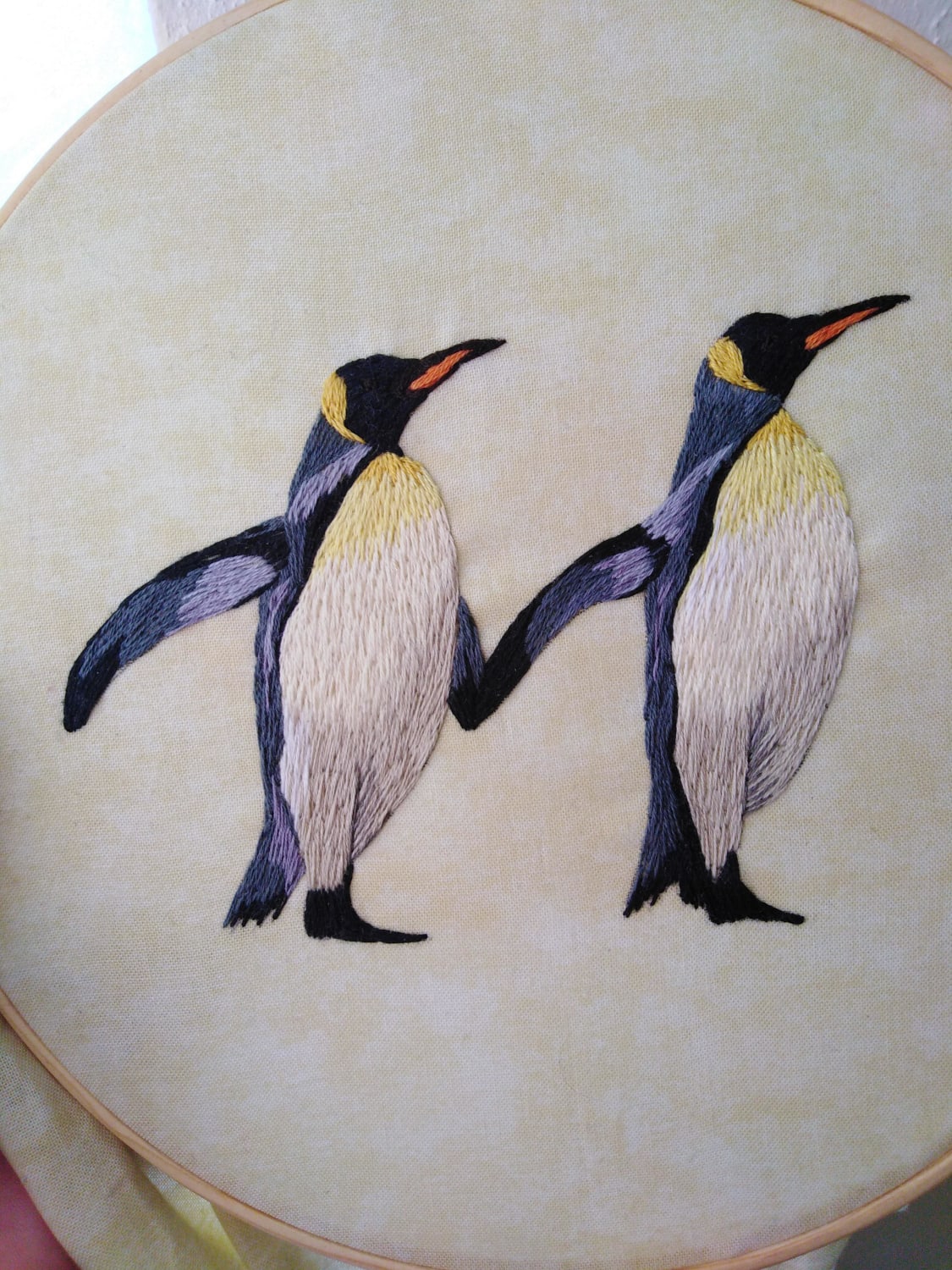 these two embroidered penguins