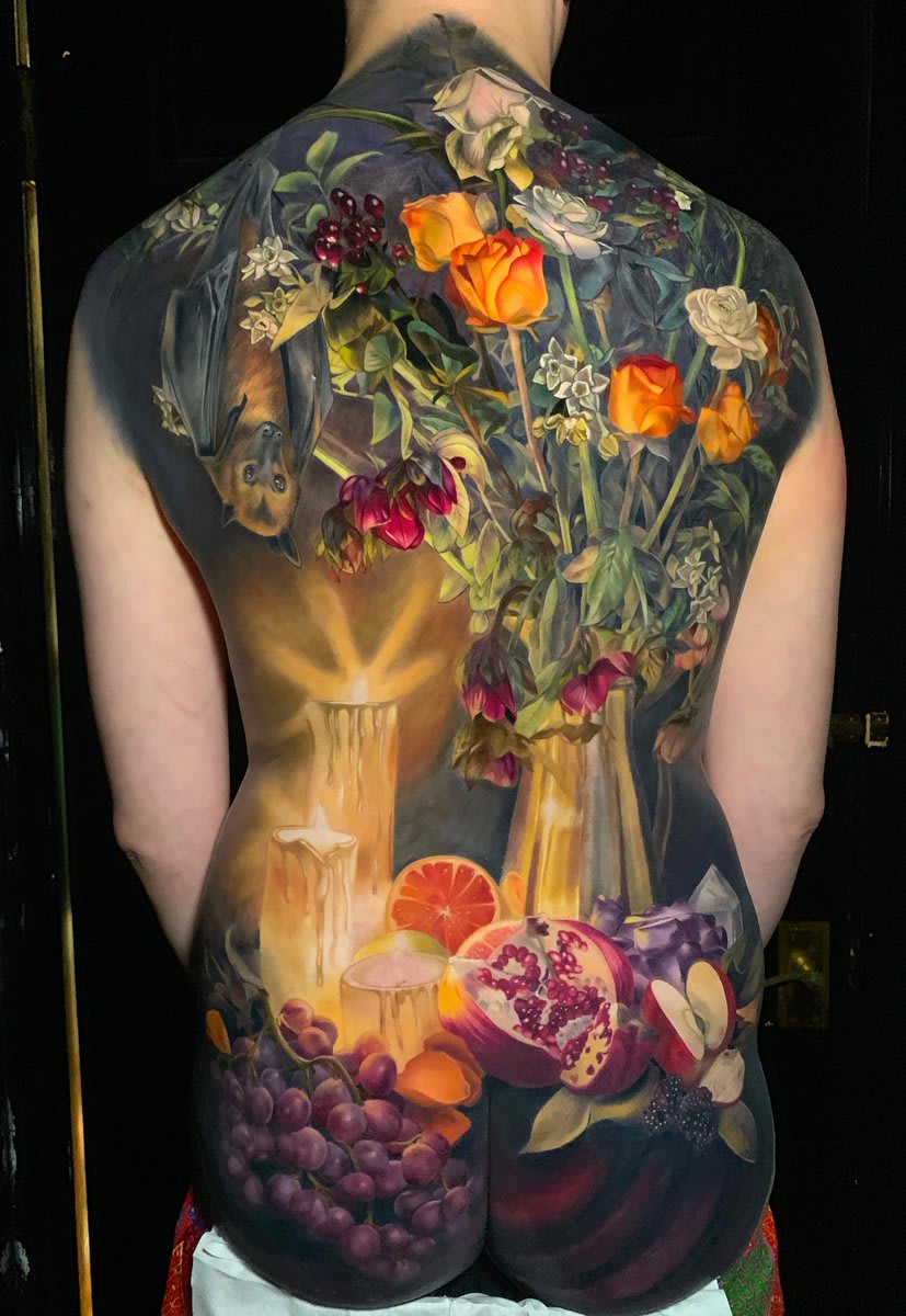 Elaborate chiaroscuro tattoos by Makkala Rose burst With ripe fruit and blossoming flowers