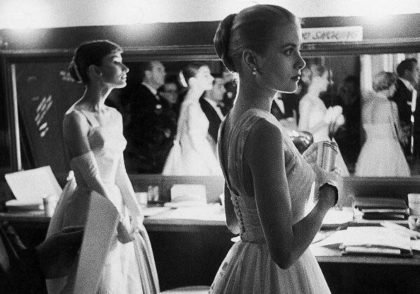 Audrey Hepburn and Grace Kelly backstage at the 28th academy awards 1956
