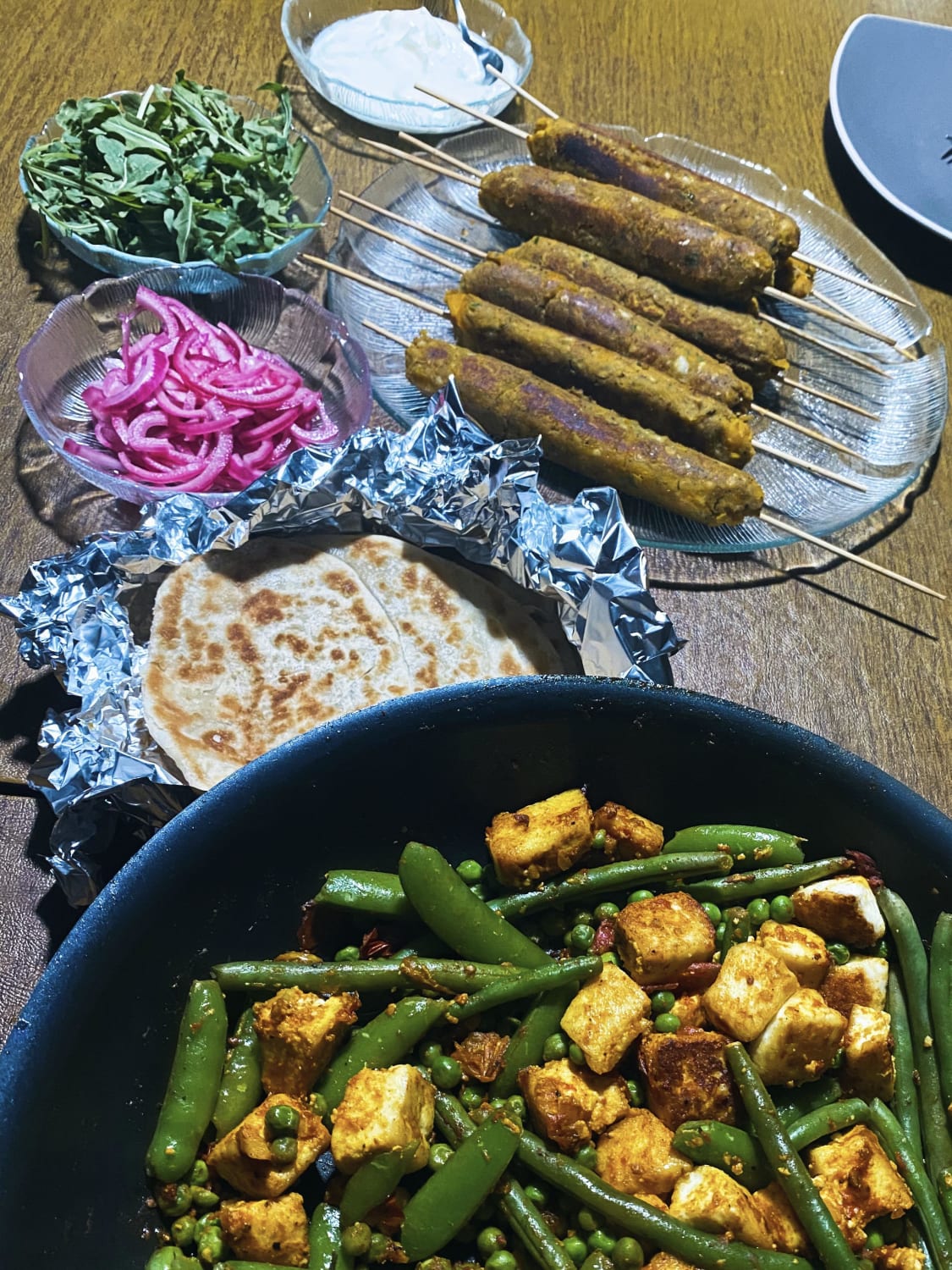 made all of this from scratch: butternut squash and chickpea kebabs, parathas, and an updated take on matar paneer