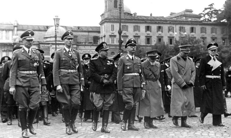(Left to right) Karl Wolff, Reinhard Heydrich, Adelchi Serena, Heinrich Himmler, Emilio De Bono, Rodolfo Graziani and Hans Georg von Mackensen at the funeral of Arturo Bocchini, head of the Italian police and of the OVRA, the Fascist secret police. Rome, 21 November 1940.