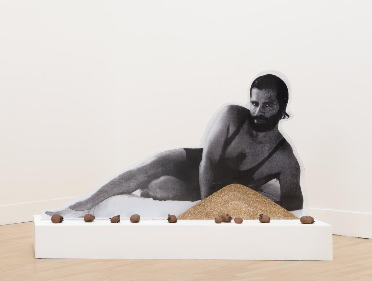 WorkoftheWeek is Anthea Hamilton’s ‘Karl Lagerfeld Bean Counter’, a sculpture at Tate Britain showing a young Karl Lagerfeld lounging behind a pile of buckwheat and a row of potatoes.