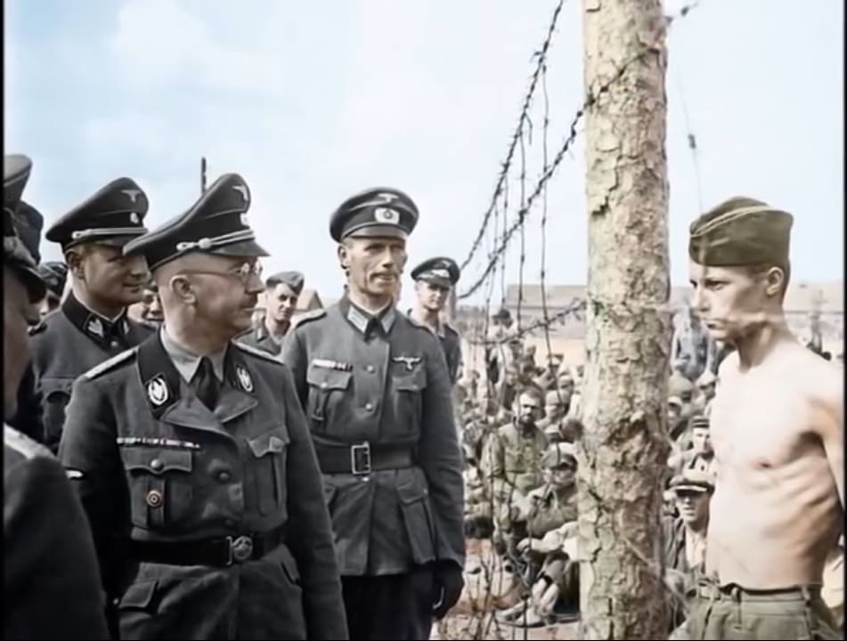 Prisoner has a stare down with Heinrich Himmler.
