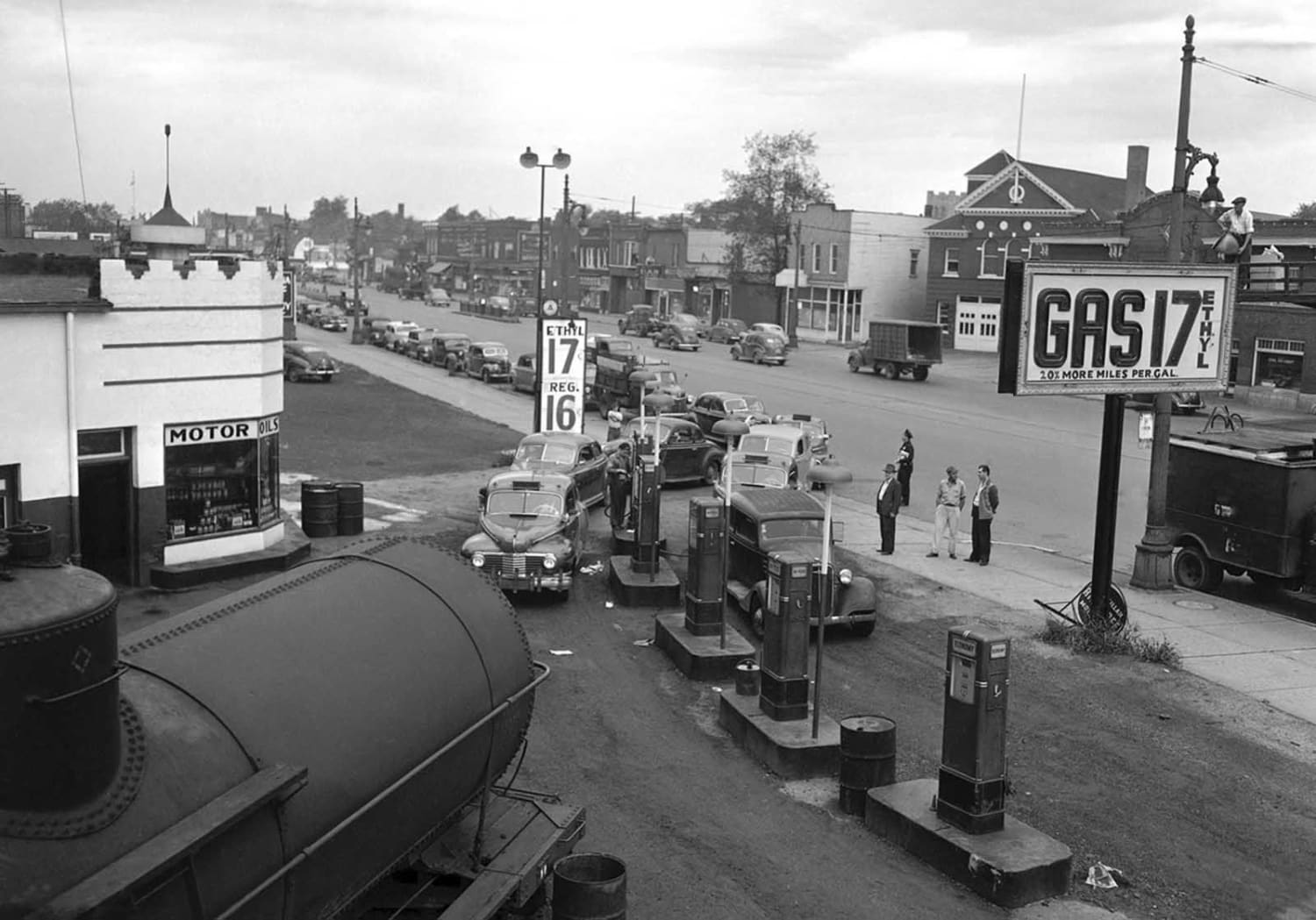 Motorists line a street waiting to buy gasoline at 17 cents per gallon at this station in Detroit on September 24th, 1945.