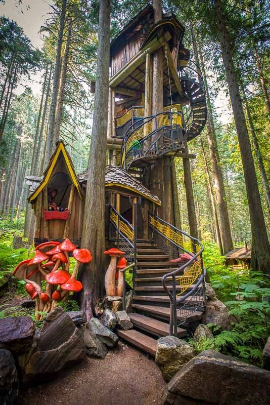 A tree house in the forest that looks like it's made of fairy tales