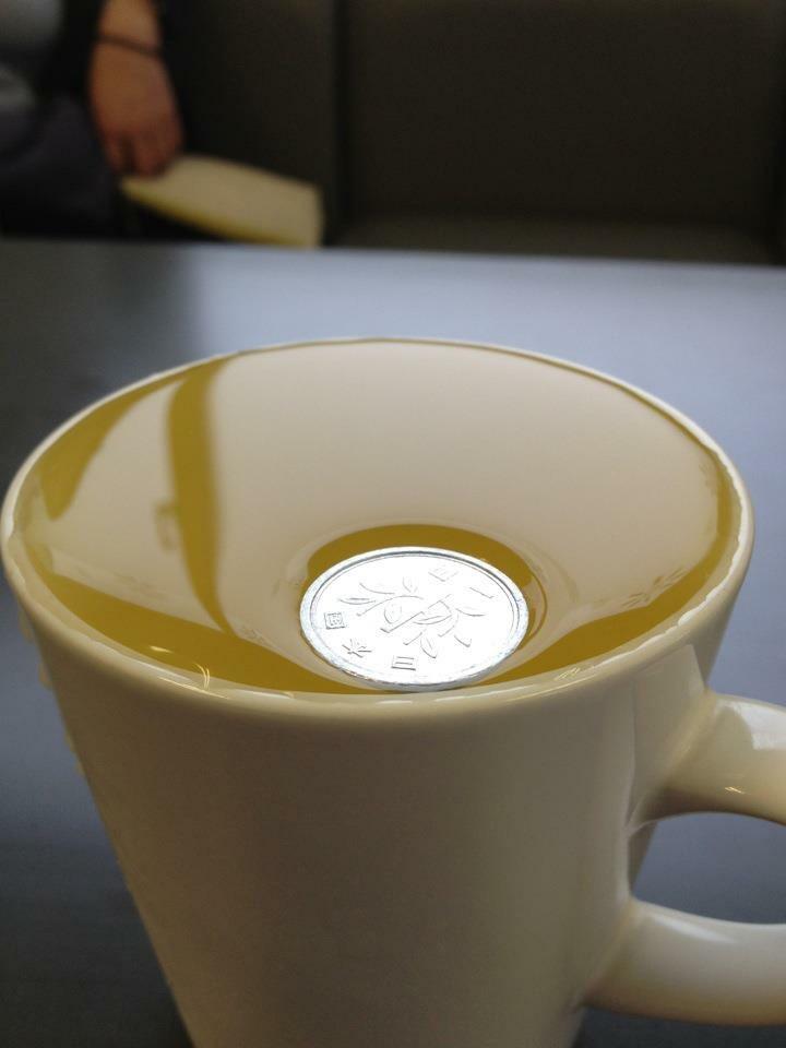 A Japanese ¥1 (Yen) coin is so light it will not break surface tension on water.