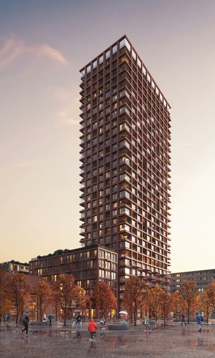 rising 100 meters with a terracotta facade, the world's tallest timber tower is expected to complete in switzerland in 2026.