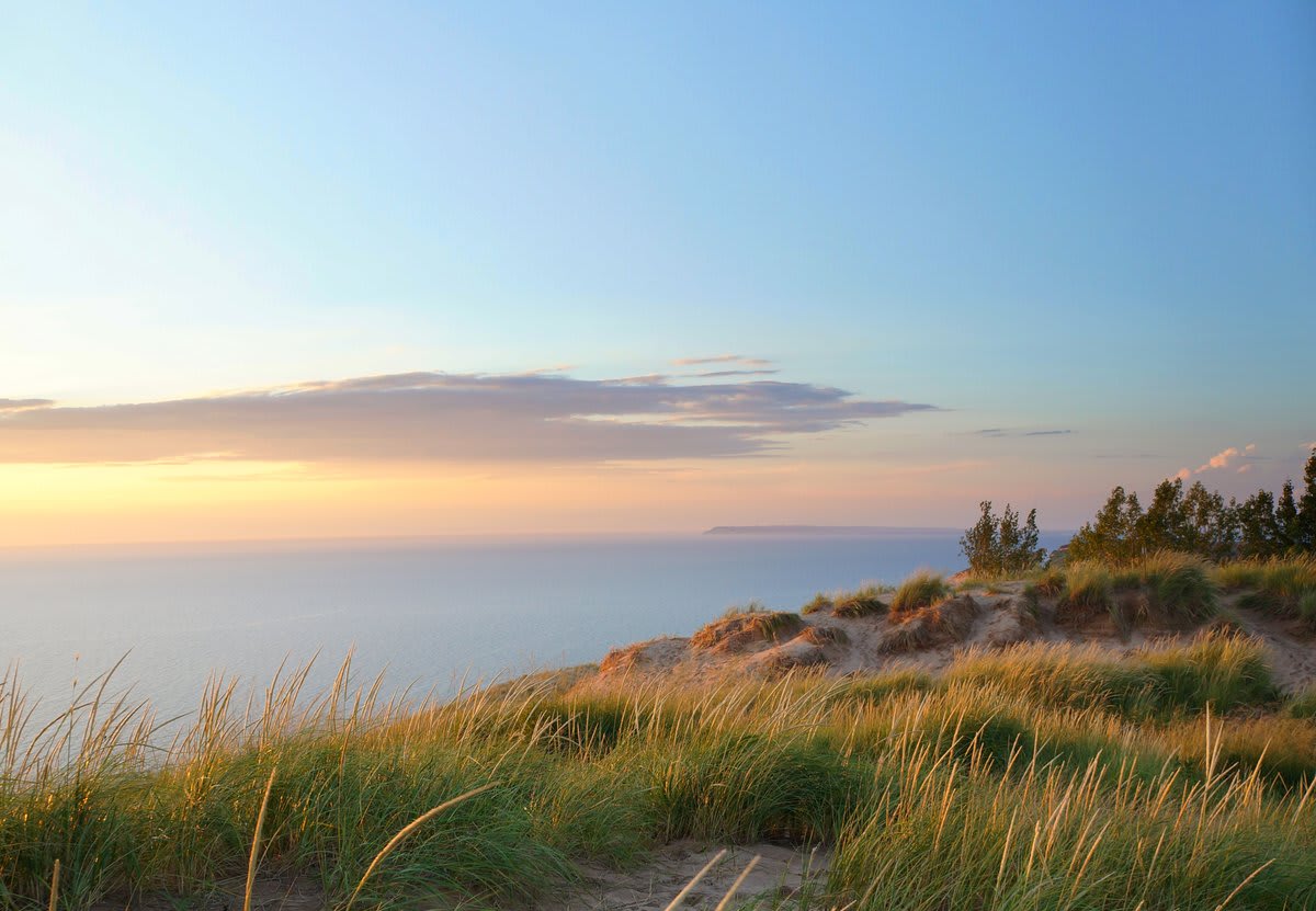 Miles of sand beach, bluffs that tower 450’ above beautiful Lake Michigan, towering dunes and incredible recreational opportunities await visitors @SleepingBearNPS in Michigan. Photo by Patricia Nava