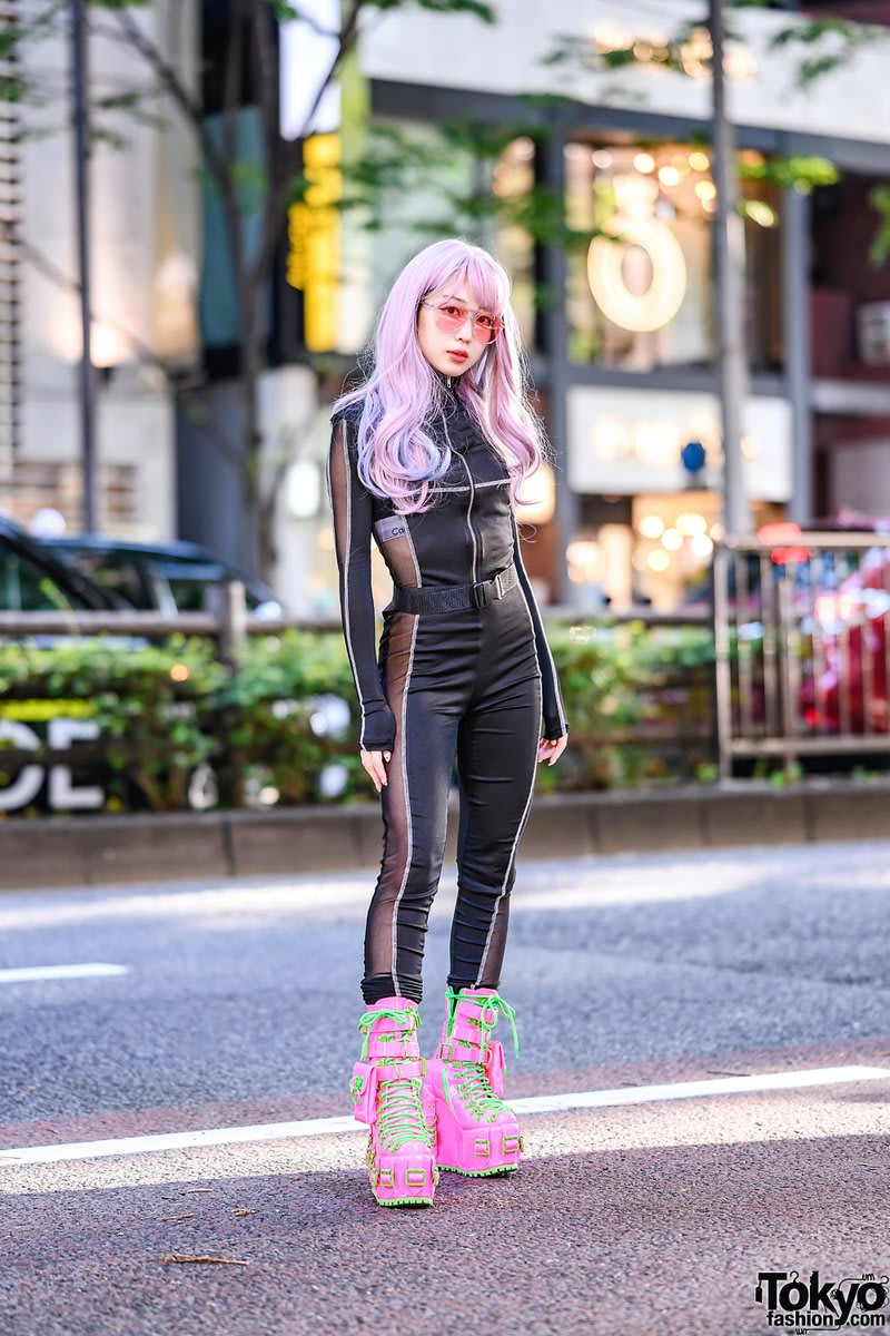Japanese model, Hatsune Miku fan & Tokyo street style personality Misuru (@MISURU0731) on the street in Harajuku wearing a cutout bodysuit w/ oversized sunglasses from GR8 Harajuku and Club Exx hot pink platform boots with neon laces
