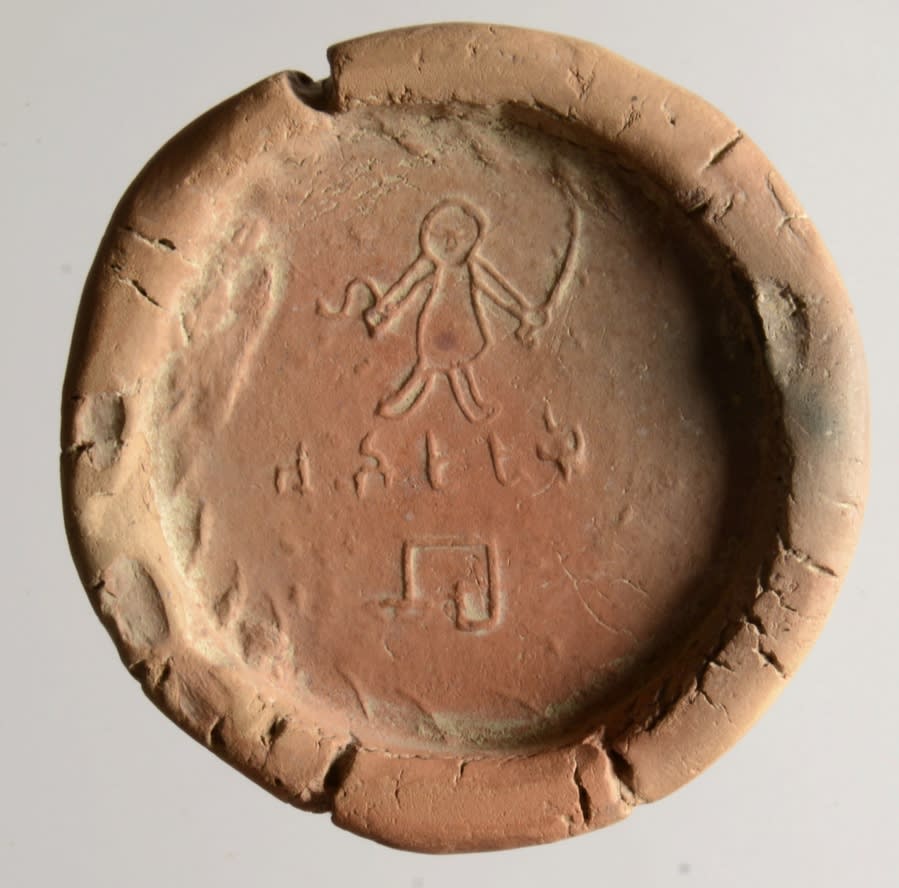 Clay Sealing showing a Stick Figure holding a sword with Brahmi script, 3rd-4th Century CE, Found at Rajghat, Bihar, Allahabad Museum, Prayagraj, India.