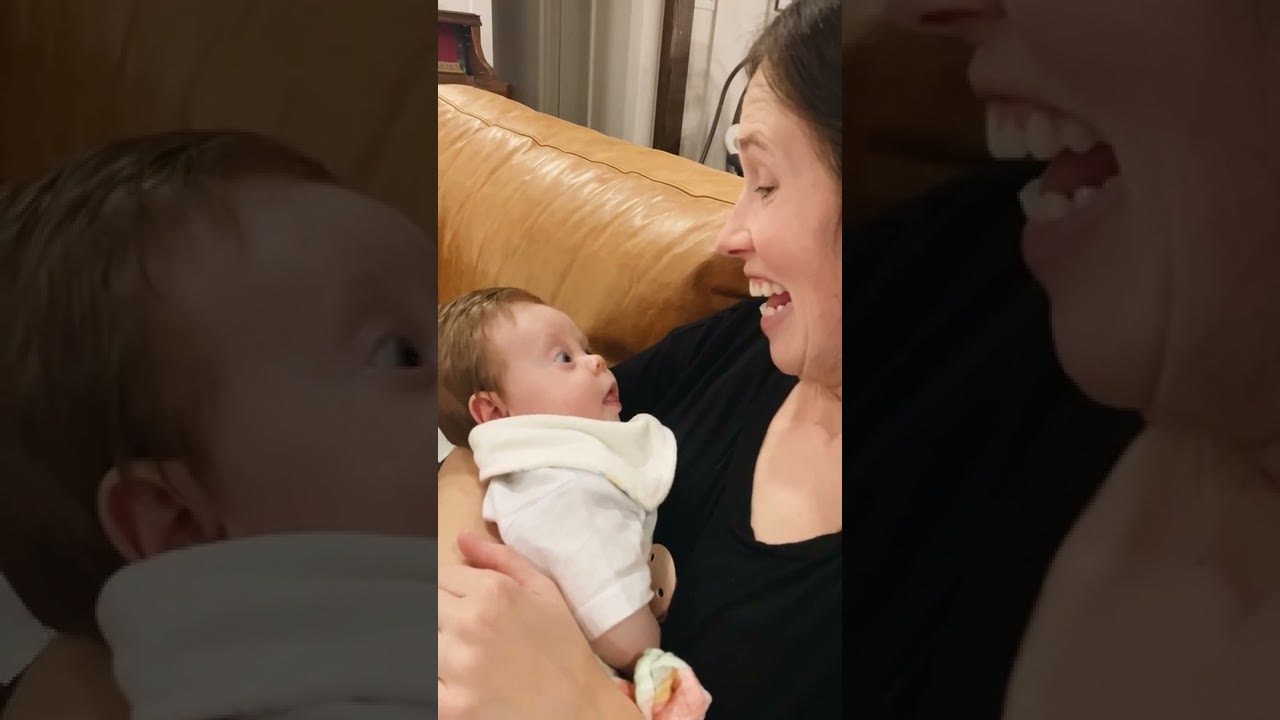 Baby Copies Mom as She Sticks Her Tongue Out - 1281269