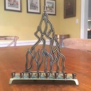 "This is our family menorah. We lit it every Hanukkah when I was a child, when I returned home as a young adult and later for my children when we celebrated the holiday at my parents’ house. My mother, was a 1st generation American... As a kid, she often…