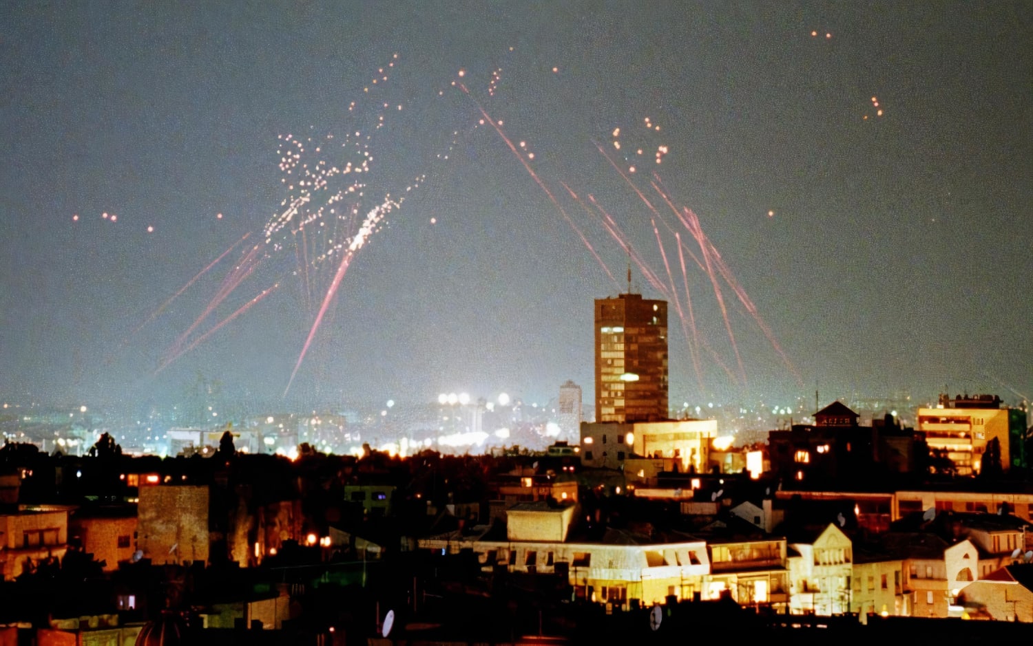 Anti-aircraft fire lights up the skies over Belgrade, Serbia, FR Yugoslavia during a NATO bombing run. June 1999.
