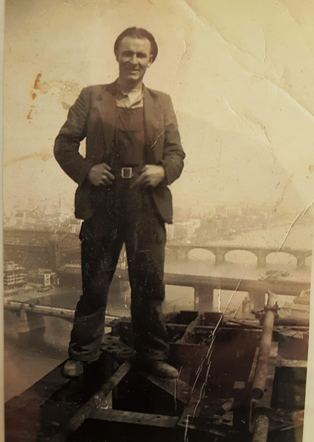 My grandfather atop (what I think is) the chimney of the Bankside power station in London during the early 1950s. He also worked on the Battersea power station chimneys.