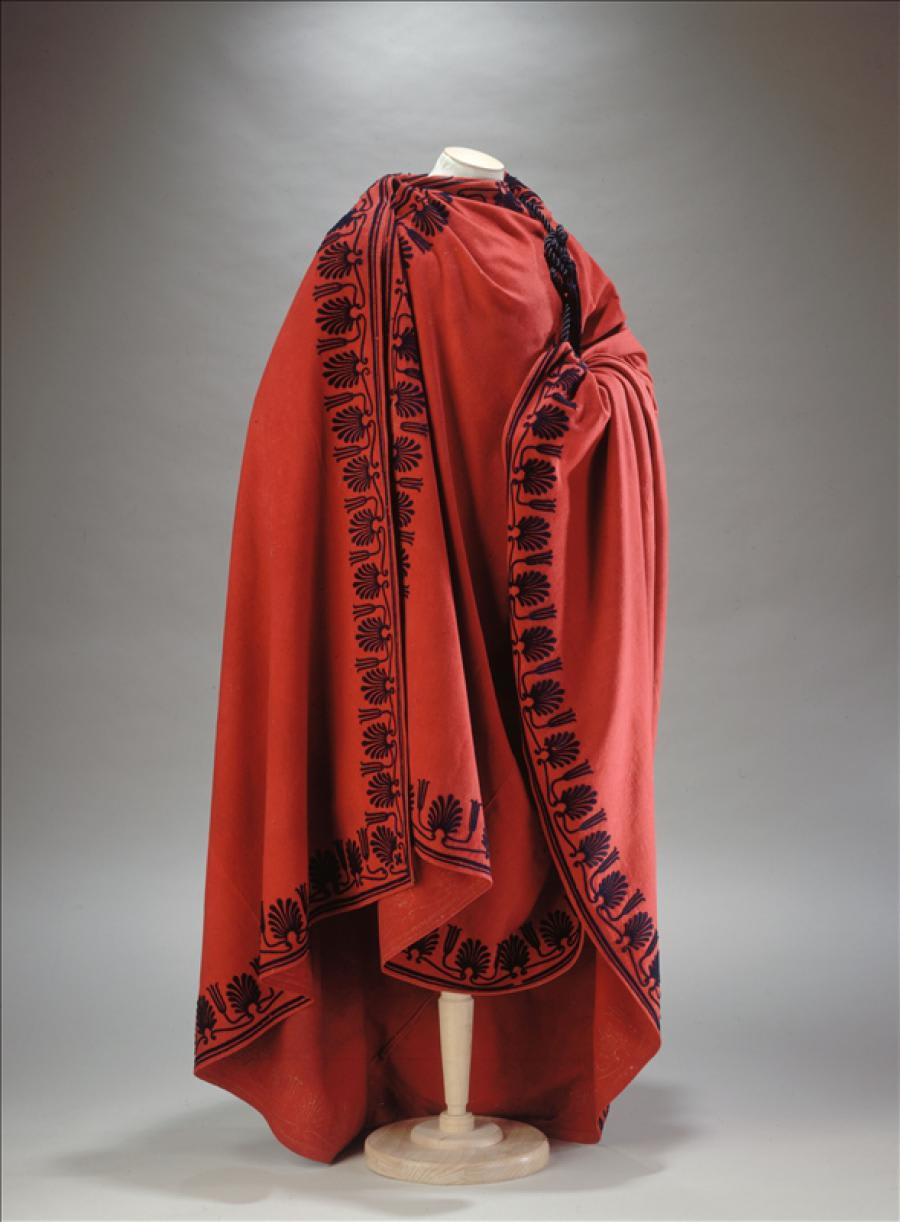 'The people's representative' coat worn by the representatives of the people at the council of elders during the directory period of the French revolution. Circa 1798, red woollen cloth, appliqué embroidery of dark blue wool. Now housed at the Palais Galliera in Paris