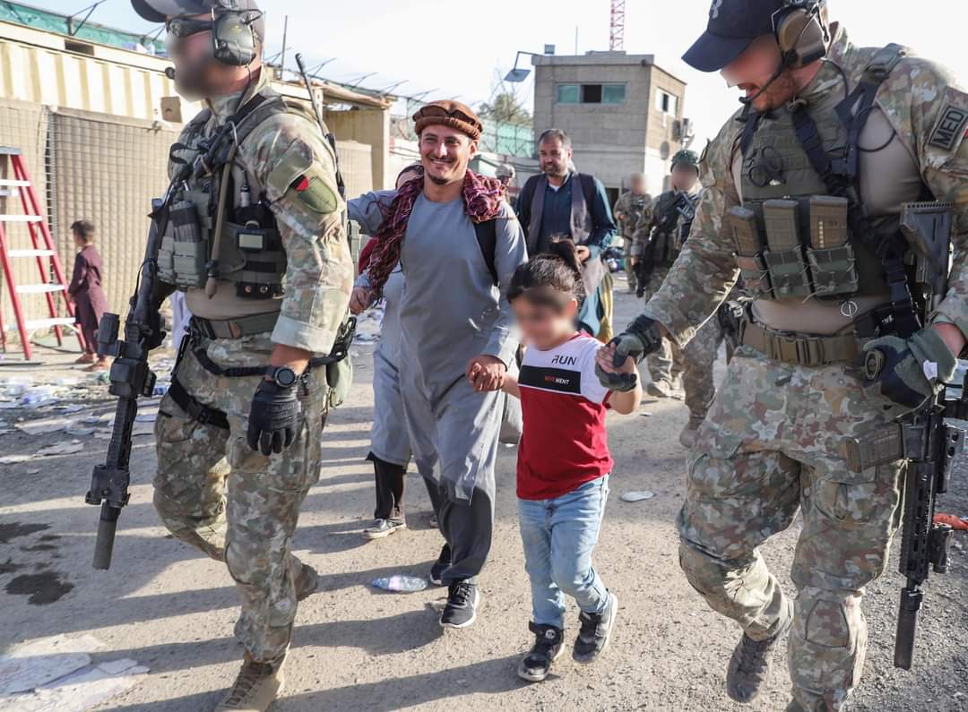 Lithuanian Special Forces escort an interpreter and his family in Kabul airport