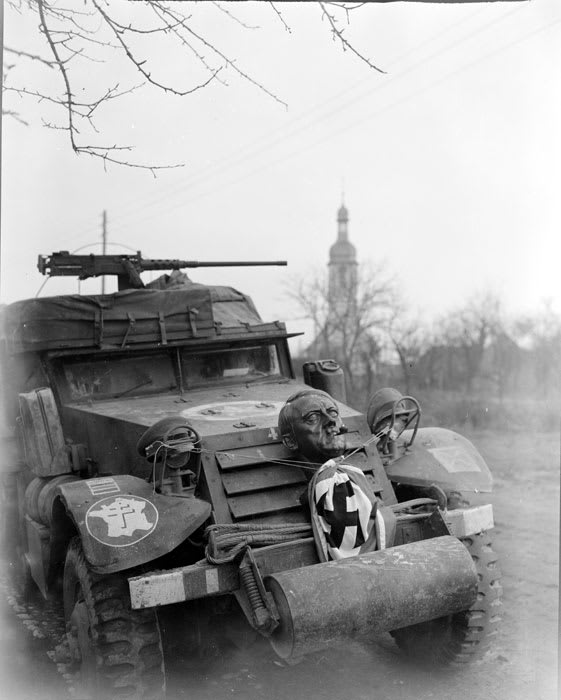 Ally halftrack with the face of a statue of Hitler, shot taken near Strasbourg, November 1944