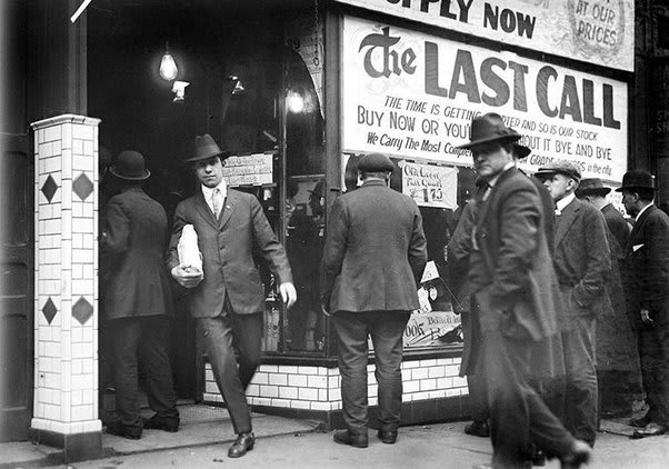 Men line up outside a "last call" liquor sale in Detroit before Nationwide Prohibition under the 18th Amendment was passed, 1920.