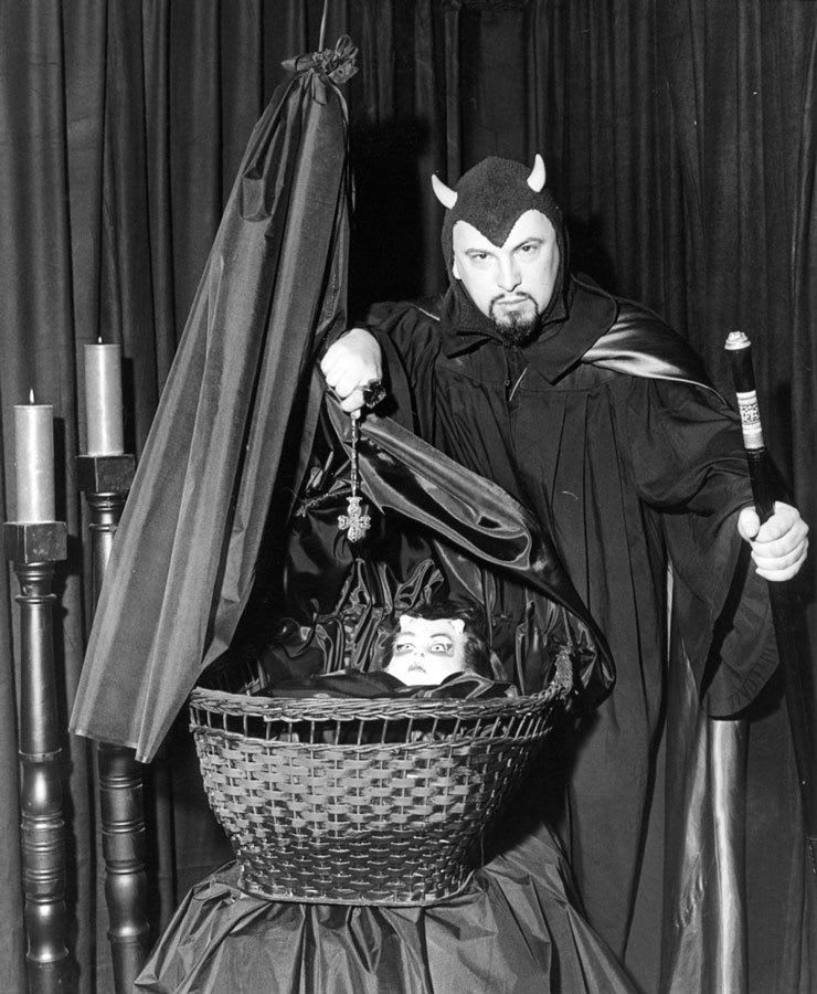 Anton LaVey poses with a wax statue of Rosemary's Baby, 1967